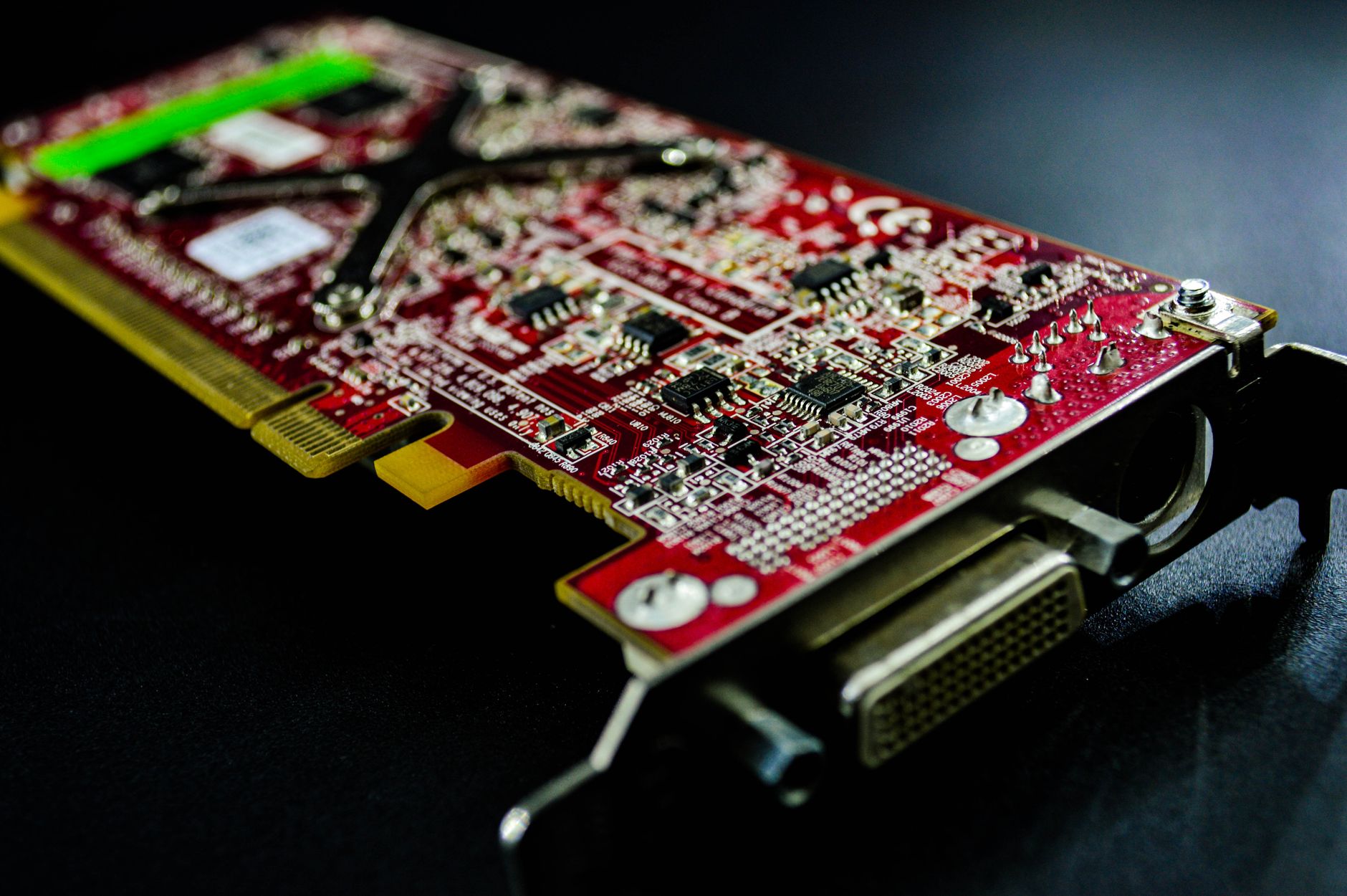 Detailed close-up of a red circuit board highlighting electronic components and connectors.