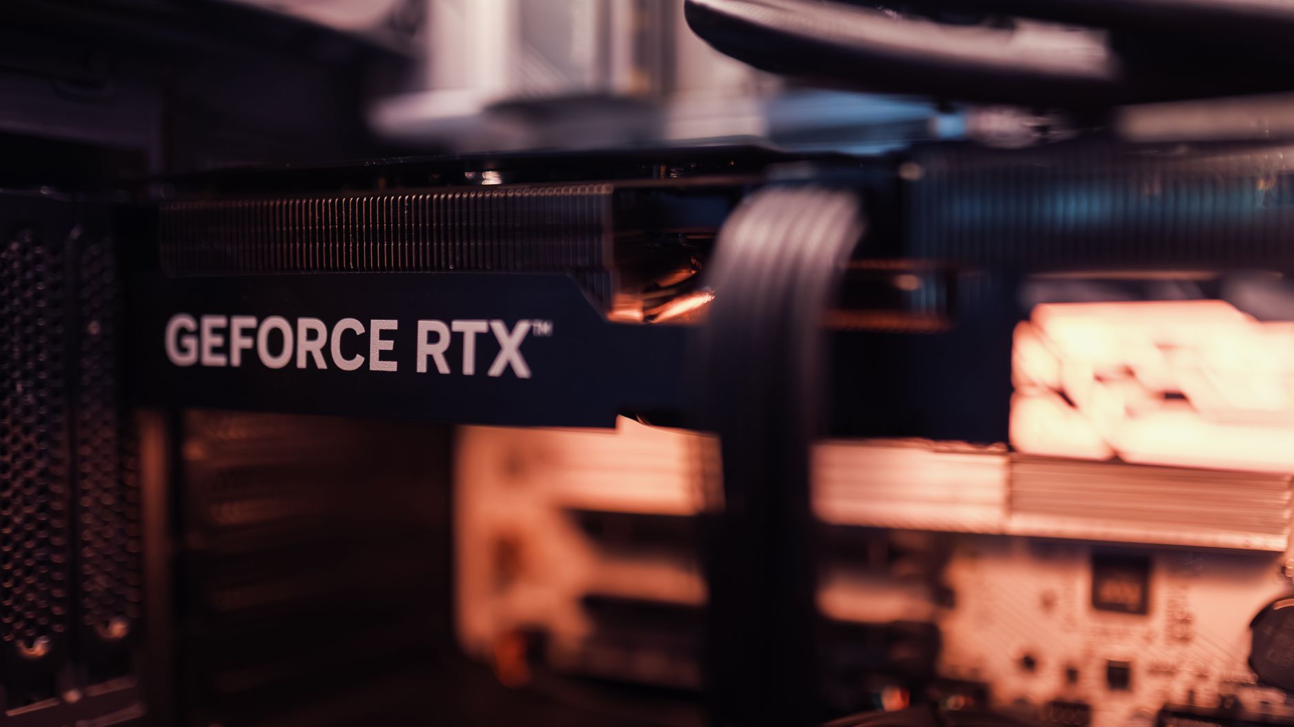 Close view of a GeForce RTX graphics card installed in a computer.